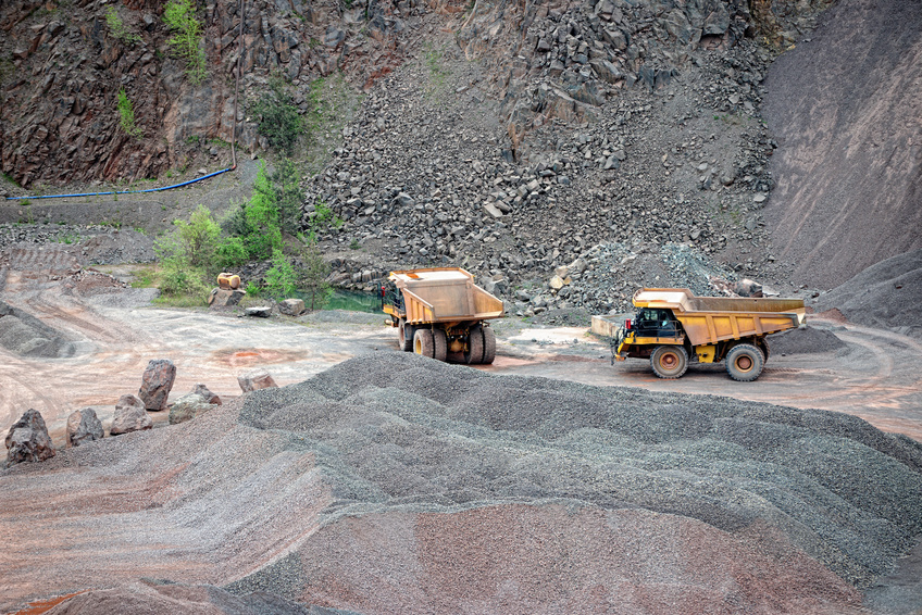 two dumper trucks in a quarry. mining industry.